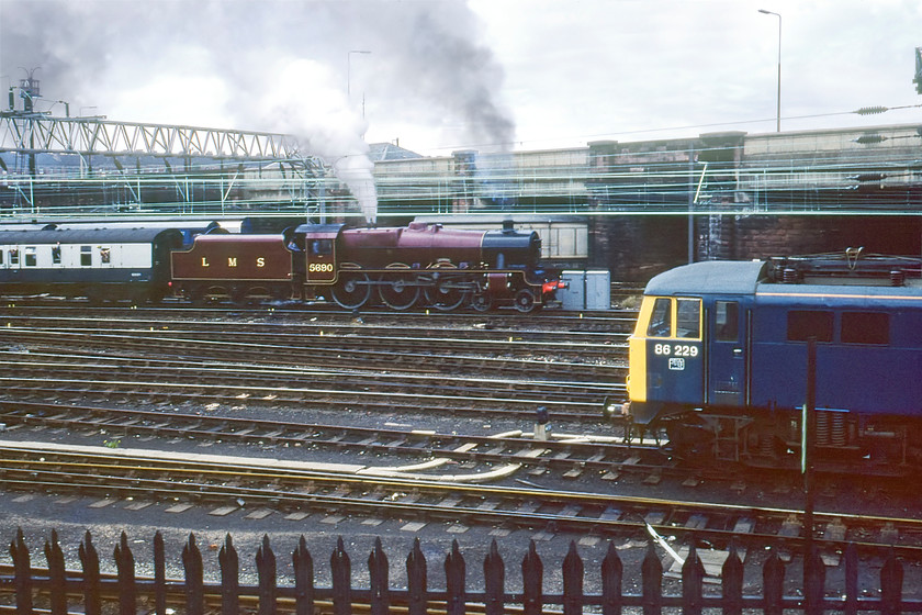 5690, BR sponsored Manchester-Liverpool Edge Hill Special & 86229, Edge Hill 
 My third and final photograph of 5690 'Leander' leaving Edge Hill yard for the station a short distance from this spot under the bridge that carries the B5178 Wavertree Road over the tracks. It was then going to run round on the Wavertree triangle to rejoin the rear of the train and lead it back to Manchester as part of the BR organised Rocket 150 celebrations. 86229 is seen in the foreground stabled in the yard. This AL6 survived until 2008 finishing its working career in Virgin West Coast's distinctive livery.

There is an audio recording of this event on my youtube channel, see..https://youtu.be/dC3Vdy6E4t8 
 Keywords: 5690 sponsored Manchester-Liverpool Edge Hill Special 86229 Edge Hill Leander LMS Jubilee