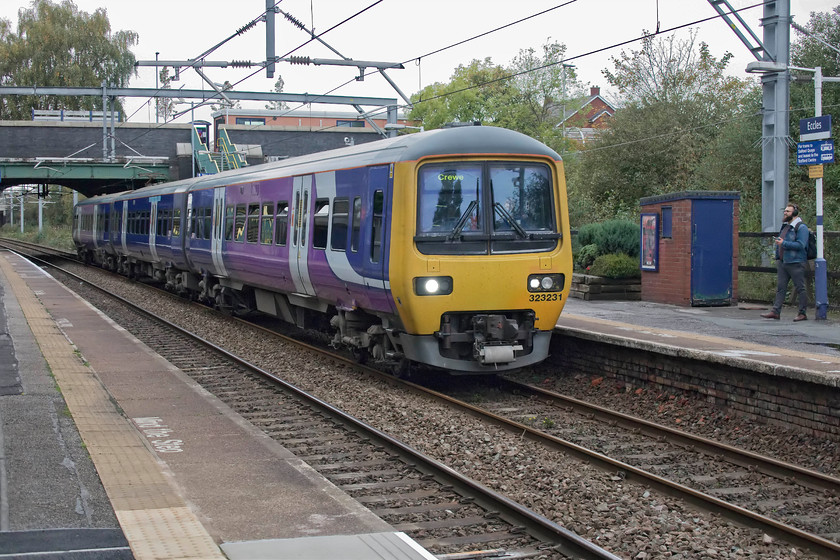 323231, NT 16.28 Liverpool Lime Street-Crewe (2A92, 1L), Eccles station 
 The direct route between Liverpool Lime Street and Crewe is just thirty-eight miles. However, Northern's 323231 will cover sixty-six miles as it is routed via Manchester Piccadilly and Wilmslow. The train is seen here slowing for its stop at Eccles station. Eccles station has basic facilities with the station ticket office, built in 2103, seen on the bridge directly above the train. 
 Keywords: 323231 16.28 Liverpool Lime Street-Crewe 2A92 Eccles station