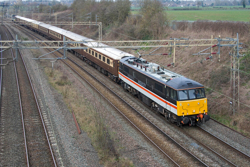 86101, 09.38 Liverpool Lime Street-Wembley Central (1Z90, 11E), Victoria bridge 
 The first of two up footex charters heading to Wembley from Liverpool passes Victoria bridge just south of Roade. 86101 'Sir William A Stanier FRS' leads the 1Z90 09.38 Liverpool South Parkway to Wembley Central operated by LSL (Crewe). The sight of an InterCity liveried Class 86 on the WCML evokes memories of days past when trains such as this would probably have not attracted my attention in the same way that Pendolinos do today! 
 Keywords: 86101 09.38 Liverpool Lime Street-Wembley Central 1Z90 Victoria Bridge "Sir William A Stanier FRS"