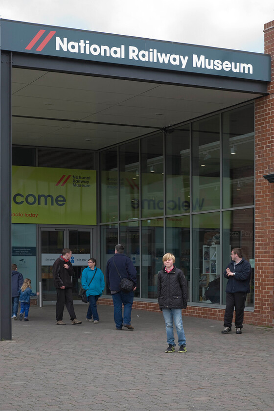 Frontage, NRM 
 The 'new' frontage' of the NRM at York is a familiar sight to many visitors. This entrance replaced the older entrance that was the other side to Leeman Road with the two parts of the museum now linked by a pedestrian tunnel. Whilst the museum remains free it has recently undergone a funding crisis where the reintroduction of an entry fee was proposed with even complete closure actively discussed by the Science Museum Group who operate the museum. Thankfully, the funding crisis was avoided with the intervention of the Tory chancellor George Osborne who withdrew his plans to cut the group's funding by ten per cent (an estimated real-terms 25%) as part of the Tory Government's austerity agenda.