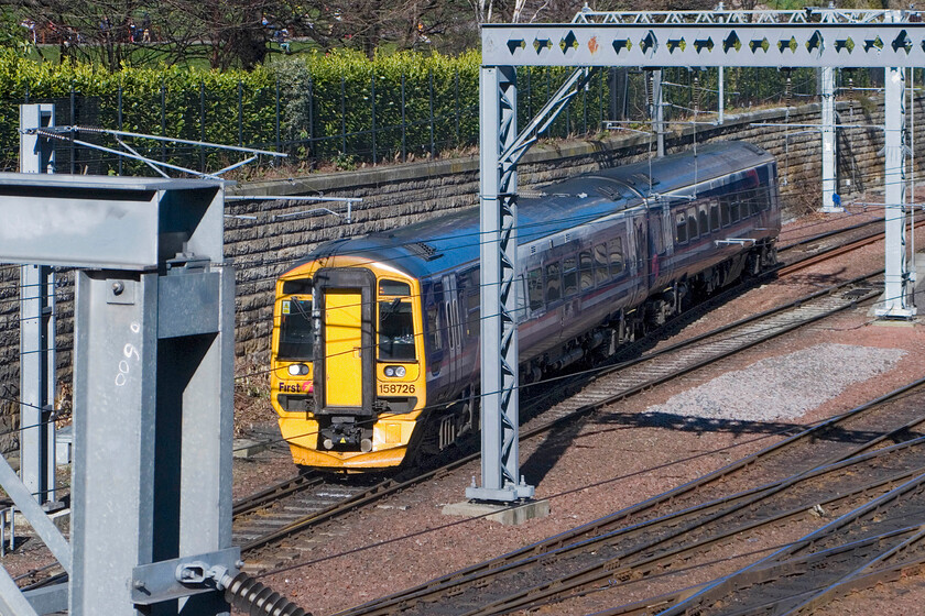 158726, SR 15.47 Newcraighall-Glenrothes, Edinburgh Waverley station from The Mound 
 The 15.47 Newcraighall to Glenrothes First Group's ScotRail service leaves Edinburgh Waverley station worked by 158726. Photography from The Mound, from where this image has been captured, is tricky now with the wiring spoiling the view but with careful timing an acceptable image is possible as is the case here. 
 Keywords: 158726 15.47 Newcraighall-Glenrothes Edinburgh Waverley station from The Mound Scotrail