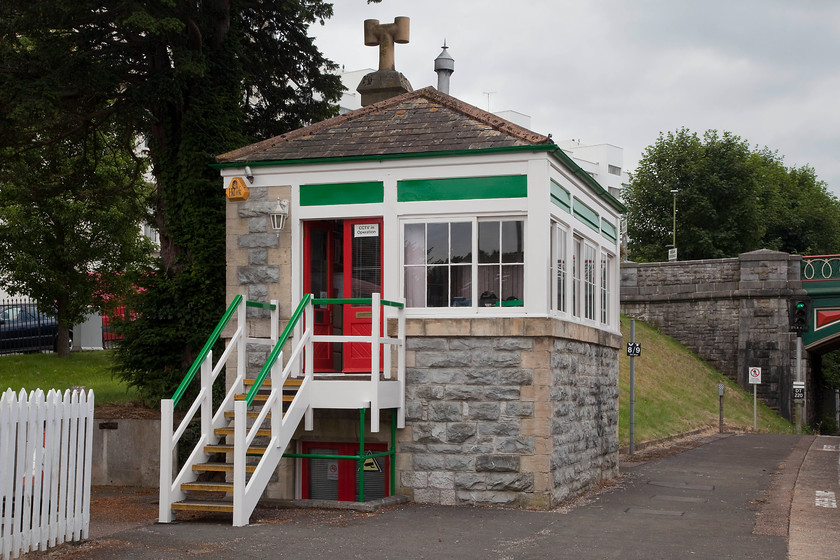 Torquay South signal box (office) (GW, 1876) 
 The lovely stone-built signal box at Torquay was constructed by the Great Western in 1876 to a Saxby and Farmer design typical of the time and area. It was not built on the platform being a free-standing structure but when the platforms were extended in 1925 they were built around the box making it look shorter in height, the door to the sunken locking-room gives it away. I managed to photograph it before closure came under BR on 15.11.84 as part of the West of England MAS scheme, see.... https://www.ontheupfast.com/p/21936chg/29500835004/p473-class-118-dmu-45055-13-50-exeter. Today, designated as a 'historic' building, it is used as an office by a local company; I couldn't think of many better places to work! 
 Keywords: Torquay South signal box