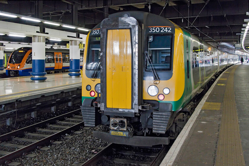 1350242, LN 14.23 London Euston-Birmingham New Street (1Y43, 1E), London Euston station 
 Our train home from London to Northampton sits just inside the entrance to Euston station. My wife and I would travel aboard 350242 and another Desiro unit working the 14.23 service to Birmingham New Street as far as Northampton. The train was busy but did empty out a fair bit on arrival at Watford Junction. 
 Keywords: 1350242 14.23 London Euston-Birmingham New Street 1Y43 London Euston station London Northwestern Desiro