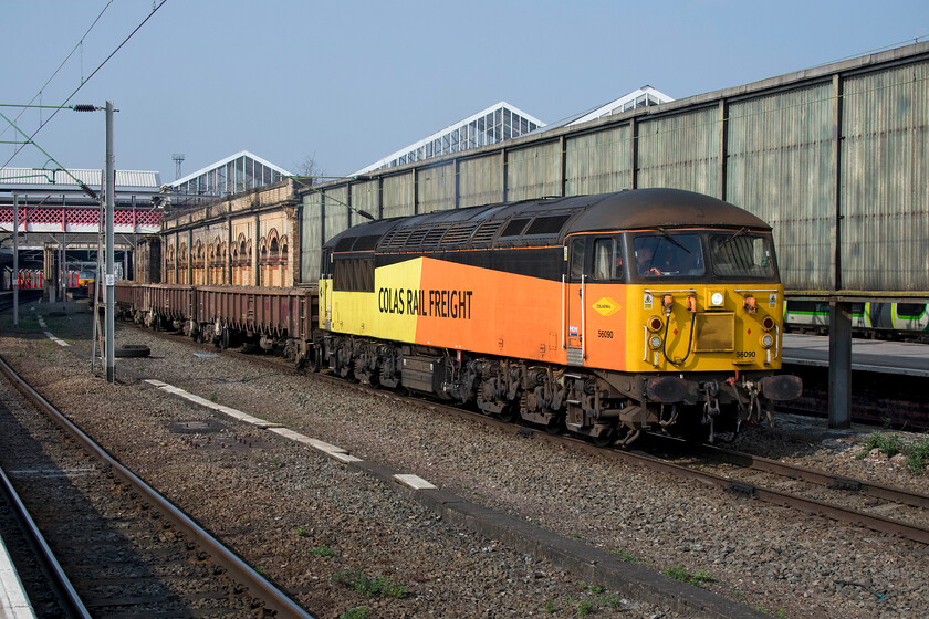 3. 56090, 13.33 Crewe Basford Hall-Longport Colas (6K39, 14E), Crewe station 
 Andy and I decided to sit in the sun at Crewe station and enjoy a coffee and watch the trains go by! When doing this by the south-facing bay platforms (two and three) we became aware of the throb of a diesel at idle somewhere on the other side of the station. So we rescued our cappuccinos and went for a walk to find this delightful view on the far western side of the station! Colas operated and veteran 56090 basks in the sunshine at the head of the 13.33 Crewe Basford Hall to Longport infrastructure working that was certainly attracting the attention of other enthusiasts on the platform as well as us! 
 Keywords: 56090, 13.33 Crewe Basford Hall-Longport Colas 6K39 Crewe station Colas Rail Freight