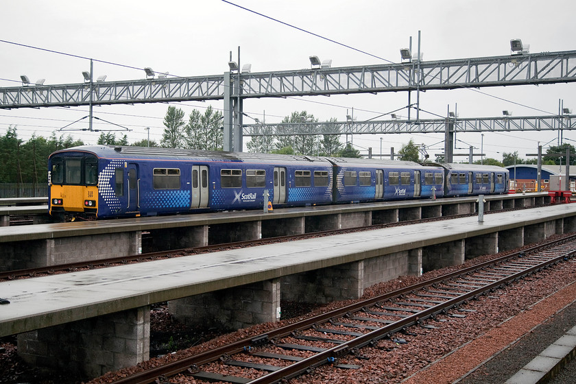 318269, stabled, Bathgate depot 
 ScotRail is likely to be disposing of its class 318s over the coming few years as more new stock is accepted in-service. Refurbished for a second time between 2013 and 2107 the units meet the new in-coming disability access regulations so still can do their job for the time being. 318269 sits idle in the extensive depot adjacent to Bathgate station. At this time it was pouring with rain and continued to do so for the next few hours. 
 Keywords: 318269 stabled Bathgate depot