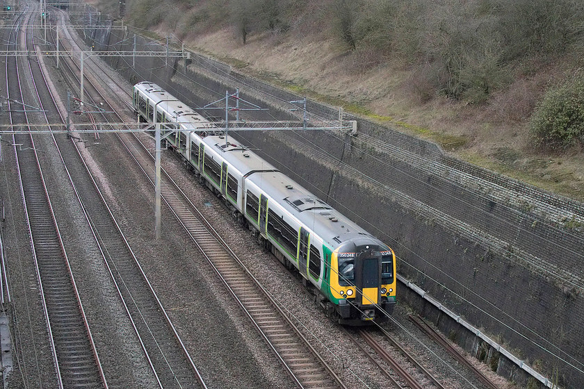 350248, LN 10.37 Crewe-London Euston (1U28, 2E), Roade Cutting 
 Taken from the lofty heights of the locally named Muddy or Dirty Lane bridge above Roade Cutting is 350248. It is forming the 1U28 10.37 Crewe to London Euston that, on a Sunday, goes via Northampton rather than the more usual route via the Weedon loop. 
 Keywords: 350248 10.37 Crewe-London Euston 1U28 Roade Cutting