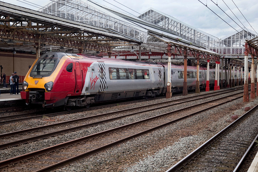 221108, VT 14.35 Chester-London Euston (1A45), Crewe station 
 221108 pauses at Crewe having not long departed from Chester, 21 miles away, with the 14.35 to London Euston. Whilst these units are fine for short journeys, their suitability for long distance journeys is questionable. 
 Keywords: 221108 14.35 Chester-London Euston 1A45 Crewe station