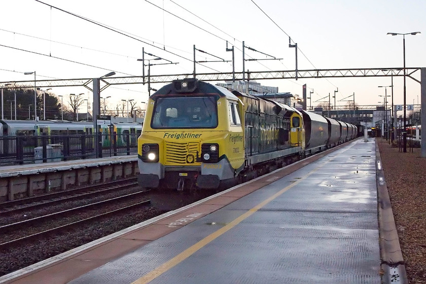 70003, 06.09 Bletchley-Crewe Basford Hall, Northampton station 
 A picture that really pushed the capabilities of the camera to the limit! 70003 leads the 06.09 Bletchley to Crewe Basford Hall empty stone train through Northampton station. I Have had to do a fair bit of Photoshop work on this image to clean it up as pushing the ISO to 1600 introduced a fair bit of digital noise. 
 Keywords: 70003, 06.09 Bletchley-Crewe Basford Hall, Northampton station