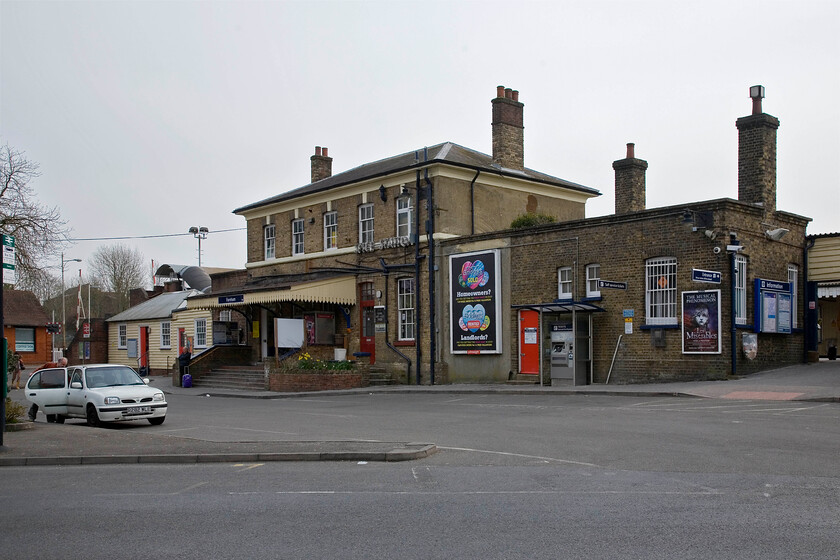 Frontage, Farnham station 
 Farnham station was opened in 1849 on the short line linking the town directly with Guildford via Wanborough but it was not until 1870 when a further line was built connecting with Aldershot and beyond. Third rail electrification came in 1937 with the initial line in the direction of Guildford then closing. Despite appearances showing an empty car park, apart from Andy with his trusty Micra, the station is usually busy primarily with commuters heading towards London. A new depot that maintains and services the Class 450 Desiros opened in 2009 and is located some distance west of the station. 
 Keywords: Frontage Farnham station