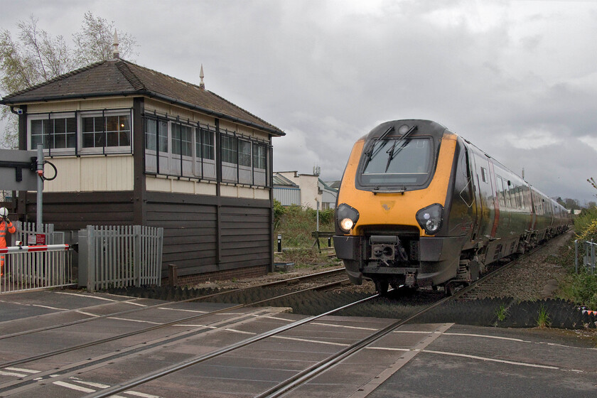 221124, XC 06.27 Plymouth-Edinburgh Waverley (1S39, RT), Alstone Lane crossing 
 Passing a classic Midland signal box of 1891 vintage just north of Cheltenham station at Alstone Lane level crossing 221124 gets into its stride working the 06.27 Plymouth to Edinburgh Waverley service. While the weather is super dull this morning it's actually a blessing in disguise as this photograph would have been all but impossible if the sun had been out as it was looking southeast! 
 Keywords: 221124 06.27 Plymouth-Edinburgh Waverley 1S39 Alstone Lane crossing