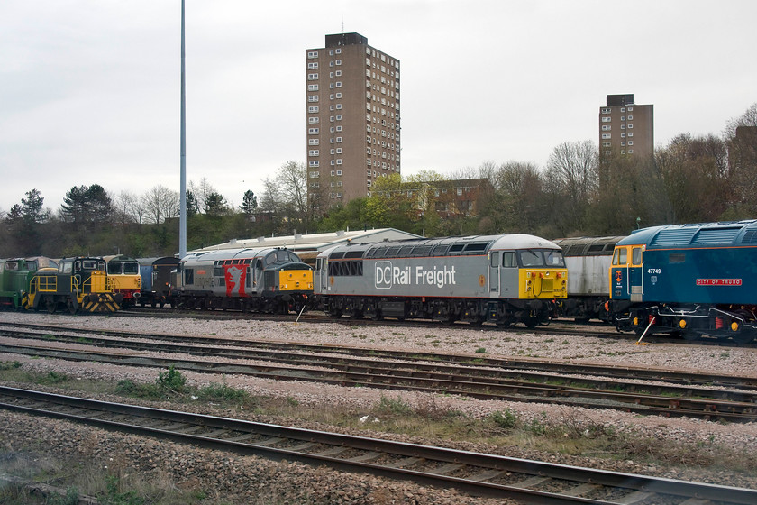 D1388, shunter, 58016, 37901, 56103 & 47749, stabled, UKRL depot, Leicester 
 An impressive line-up of heritage motive power at UKRL (UK Rail Leasing LTD) Leicester facility. Just peeking into the far left is Hudswell shunter D1388 then an un-numbered and unidentified shunter (help anybody?). Just in view is the end of 58016 then 37901 'Mirrlees Pioneer' and 56103. Finally, to the right is 47749 'City of Truro'. As 47076, this was a locomotive that I knew well when I began my spotting career in the West Country during the mid 1970s being one I saw too many times to mention. 
 Keywords: D1388 58016 37901 56103 47749 UKRL depot Leicester