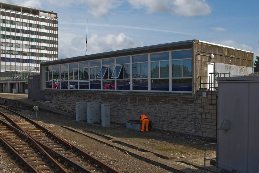 Plymouth signal box (BR, 1960) 
 This unassuming 1960s structure is actually Plymouth signal box. It was constructed in 1958 and opened in November 1960. At that time it led to the immediate closure of six mechanical boxes. Over the next fifteen years the panel was gradually expanded leading to it taking over the signalling of an ever wider area. The Western Region appeared to be leading the way with these advances that makes it even more ironic that virtually all of Cornwall still remains to this day a bastion of classic mechanical signalling with very little modernisation having taken place! 
 Keywords: Plymouth signal box BR British Railway 1960