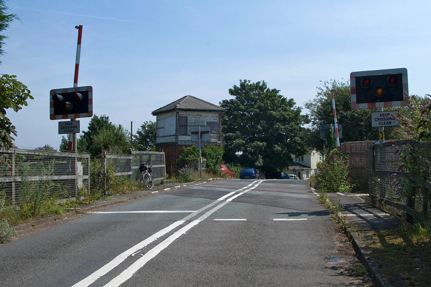 Level crossing & Fosseway signal box SK100079 
 Fossway or Fosseway? Whilst the signal box was named Fossway by the LNWR back in 1875 when it was opened the nearby farm from where it gets its name is quite clearly named Fosseway. The railways had a habit of artistic licence when it came to subtle alteration or interpretation of existing names. Interestingly, this location in Staffordshire is not close to the famous Roman Road of the same name that itself is written as two words, namely Fosse Way. In this view, looking east the level crossing is seen with the former 1875 LNWR signal box looking a little forlorn in anticipation of its next train but I suspect that this will not happen again! Notice my trusty Raleigh Royale propped up against the fencing. 
 Keywords: Level crossing Fosseway signal box SK100079