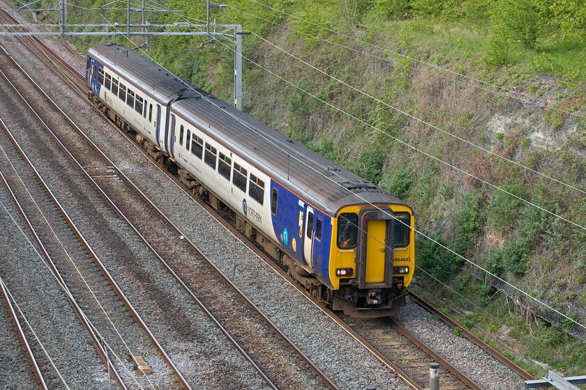 156458, 11.17 Heaton TMD-Wolverton Works (5H70, 32E), Hyde Road bridge 
 Northern units are rare visitors to Northamptonshire! More usually found in the Tyne Valley or crossing the Pennines 156458 is almost at the end of its journey south close to its destination of Wolverton Works. Wolverton is doing various work to second-generation DMUs (and also EMUs) to extend their life. A contact of mine who is employed undertaking this work tells me that alarming corrosion to the floors of these units is taking a lot of time to repair and replace. This unit left Heaton (Newcastle) at 11.17 running as 5H70. There was also supposed to be a GWR unit heading this way from Bristol also going to Wolverton but it was cancelled as it had not left Exeter the previous day. 
 Keywords: 156458 11.17 Heaton TMD-Wolverton Works 5H70 Hyde Road bridge Northern