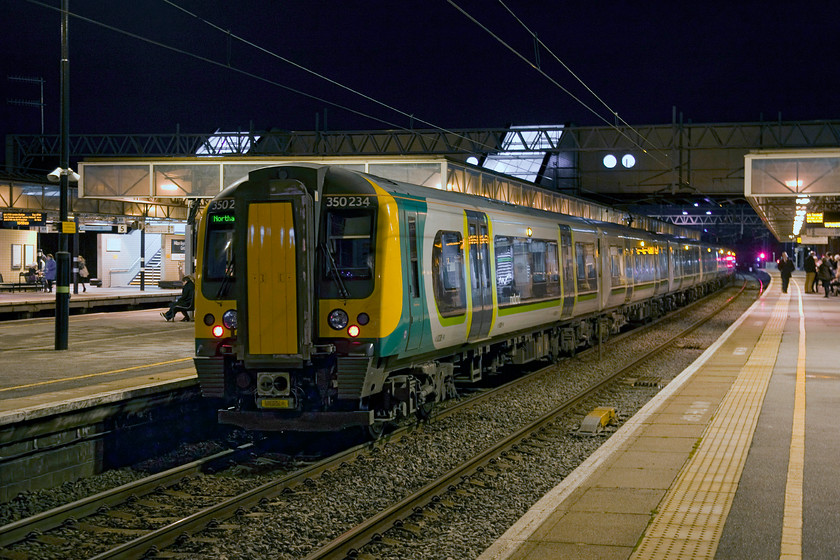 350234, LM 16.13 London Euston-Northampton (1N57), Milton Keynes station 
 350234 pauses at Milton Keynes working the 16.13 Euston to Northampton commuter service. I have said it before, I really like taking photographs at night. Images take on a whole new atmosphere conveying a different mood on and around our railway. 
 Keywords: 350234 16.13 London Euston-Northampton 1N57 Milton Keynes station London Midland Desiro