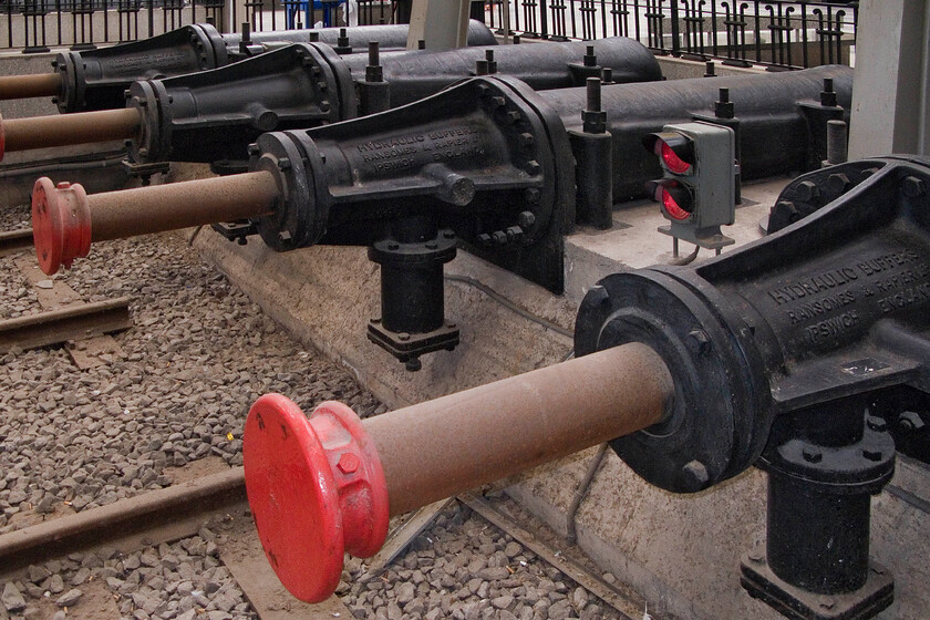 Buffer stops, Barcelona Frana station 
 Nice to see a UK company represented on Spanish railways! The hydraulic buffer stops at Barcelona's Frana station protecting over-running trains are impressive pieces of hardware seen lining the platform ends. They were manufactured by Ransomes & Rapier of Ipswich who were renowned for their engineering skills that were utilised throughout the world including China's first railway from Shanghai to Wusong. Ransomes and Rapier themselves was a company hived off from Ransomes, also in Ipswich, which was better known for the manufacturing of Victorian farming equipment. 
 Keywords: Buffer stops, Barcelona Frana station