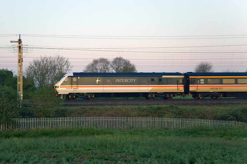 82139, 03.35 Crewe HS-London Euston (5Z90, 2E), between Roade & Ashton 
 I had been planning to get out and photograph the up ECS service for The Emerald Isle Express charter later in the day figuring that there would just be enough light if it passed on-time. When I checked its progress on RTT at 05.00 it was running twenty minutes early meaning that there would not be enough light so I gave up any idea of getting a photograph. However, a little later I spotted that it was being held at Rugby thus enabling me to grab my camera and walk across the fields close to home and position myself in one of my favoured spots. DVT 82139 leads the 03.35 Crewe HS to Euston ECS between Roade and Ashton. 
 Keywords: 82139 03.35 Crewe HS-London Euston 5Z90 between Roade & Ashton DVT Intercity Swallow