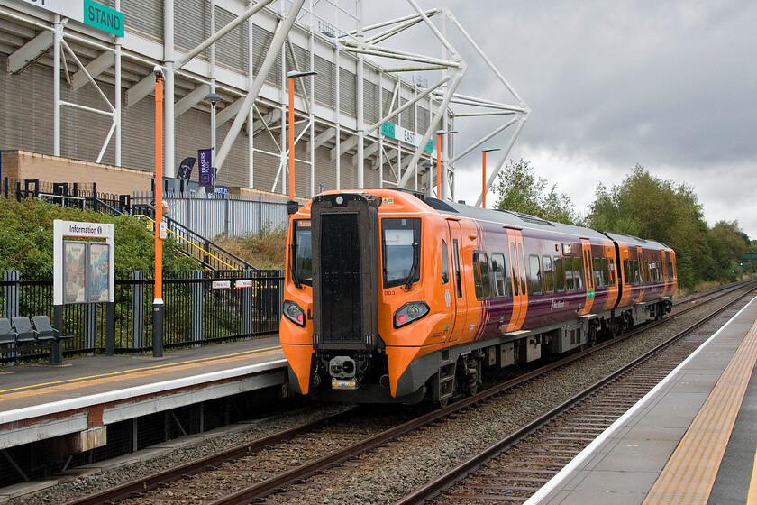 196003, LN 12.40 Leamington Spa-Nuneaton (2G79, 1E), Coventry Arena station 
 Andy was keen to stop off at Coventry Arean station as it was not one that he had been able to tick off in his book. With Coventry City's ground, previously the Ricoh Arena, to the left 196003 departs working the 14.40 Leamington to Nuneaton service. As can be seen from the sky and the wet platforms, it had indeed been raining further dampening our enthusiasm for this particular day out! 
 Keywords: 196003 12.40 Leamington Spa-Nuneaton 2G79 Coventry Arena station West Midlands Railway