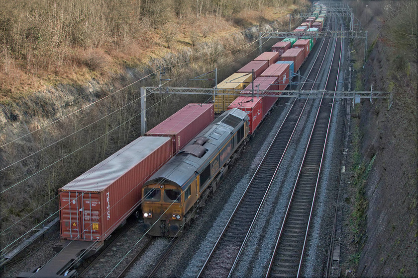 66725, 10.34 Felixstowe North-Hams Hall (4M23, 4L) & 13.07 Hams Hall-Felixstowe South (4L20, 30E), Roade cutting 
 I had been tracking the sedate progress of these two Freightliner workings on Open Train Times and figured out that they would both be with me as they passed through Roade cutting. I was spot on with my assertion! As the 4L20 from Hams Hall to Felixstowe heads south, 66725 'Sunderland' heads north with the balancing 4M23 from Felixstowe back to Hams Hall. In this brave new post-BREXIT world, it was pleasing to see both trains were absolutely full of containers going for import and export and hopefully keeping the Chancellor happy! 
 Keywords: 66725 10.34 Felixstowe North-Hams Hall 4M23 13.07 Hams Hall-Felixstowe South 4L20 Roade cutting Derby County Sunderland Freightliner