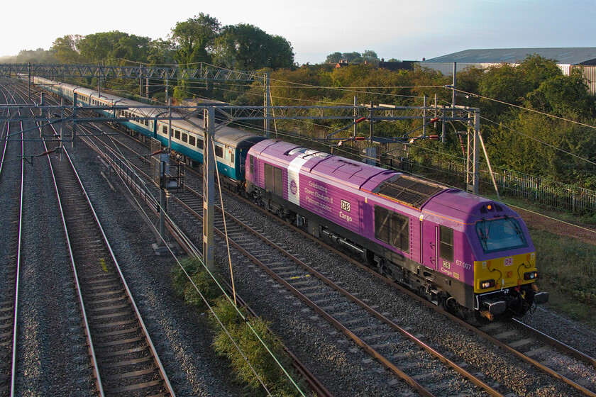 67007, outward leg of The Snowdonian, 06.51 London Euston-Bangor (1Z67, RT), site of Roade station 
 Within a few minutes of 86259 'Les Ross/Peter Pan' heading past this spot at Roade another charter does the same this time hauled by 67007. UK Railtours' The Snowdonian, or should it be The Yr Wyddfian, left Euston at 06.51 arriving at Bangor on time with passengers then able to go and enjoy various other attractions arranged by UKR. With it being such a perfectly still morning I could hear the Class 67 for some distance prior to it appearing around the curve to the rear of the frame. 
 Keywords: 67007 The Snowdonian, 06.51 London Euston-Bangor 1Z67 site of Roade station UK Railtours