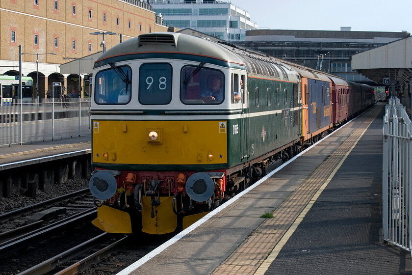 D6515, 73109, 4TC & 69002, The Return of the Jurassic Crompton, 14.20 Swanage-London Waterloo (1Z35, 7L), Wimbledon station 
 An interesting collection of locomotives and stock passes through Wimbledon station at speed conveying passengers back from what should have been a great day out at the Swanage Railway's spring diesel gala. Running as 1Z35 the 14.20 Swanage to Waterloo charter is led by Crompton D6515 (formally 33012, see.... https://www.ontheupfast.com/p/21936chg/25501874004/x33012-10-42-portsmouth-harbour-bristol ). Tucked in behind the Crompton is ED 73109 'Lt Jenny Lewis RN' Battle of Britain 50th Anniversary' wearing its GBrF livery. Passengers were travelling in former Southern Region 4TC (BR Class 438) set 413 with re-built Class 56 now 69002 'Bob Tiller CM&EE' bringing up the rear. 
 Keywords: D6515 73109 4TC 69002 The Return of the Jurassic Crompton 14.20 Swanage-London Waterloo 1Z35 Wimbledon station Lt Jenny Lewis RN Battle of Britain 50th Anniversary Bob Tiller CM&EE.