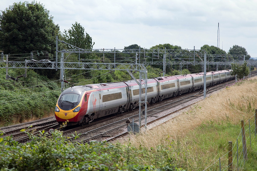 390126, VT 10.43 London Euston-Edinburgh (9S60), Casey bridge, Basford Hall Junction 
 390126 'Virgin Enterprise' just catches a few rays of rather flat sunshine as it approaches Crewe with the 10.43 Euston to Edinburgh. The picture is taken from Casey bridge where a minor road crosses the line just near to Basford Hall Junction. 
 Keywords: 390126 10.43 London Euston-Edinburgh 9S60 Casey bridge Basford Hall Junction