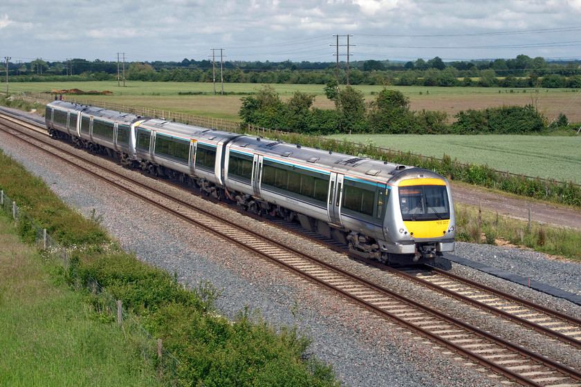 168327, CH 15.06 London Marylebone-Oxford (1T41, 5L), Oddington SP542160 
 After the rain comes the sun! 166327 leads another unit past Oddington forming the 15.06 Marylebone to Oxford service. The photograph is taken from a new and substantial overbridge near Oddington. The bridge, that replaced a user-worked crossing, carries a single-track road that leads to just five properties. Whilst the views of the new double track are clear and open, looking at the saplings already growing trackside and out of sight at the base of the bridge embankments, I suspect that in a few years shots like this will not be possible. 
 Keywords: 168327 15.06 London Marylebone-Oxford 1T41 Oddington SP542160