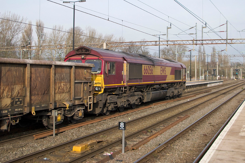 66056, 09.18 Wembley-Dowlow, Northampton station 
 66056 passes through Northampton station with the 09.18 Wembley yard to Dowlow quarry empty aggregates train. As our train that we were taking to London was sitting in the platform behind me, I had to be content with this going-away shot, at least the sun was in the right direction! 
 Keywords: 66056 09.18 Wembley-Dowlow Northampton station