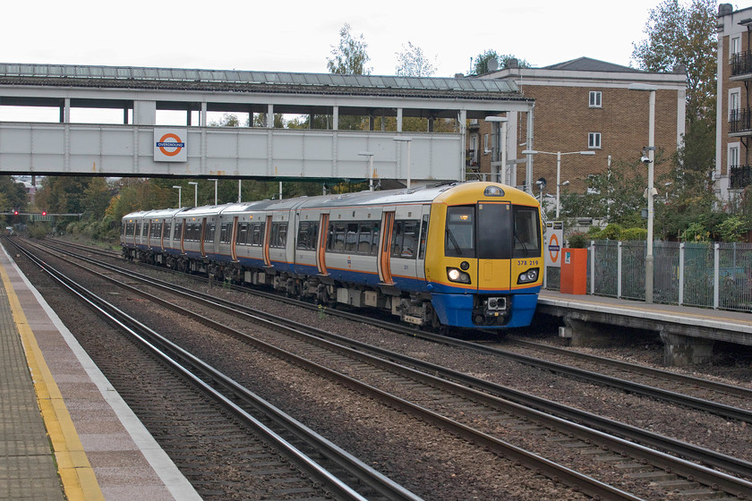 378219, LO 13.39 Stratford-Clapham Junction (2Y68, RT), Kensington Olympia station 
 Kensington Olympia station is a busy one with trains arriving and departing at regular intervals throughout the day. It has a fascinating history being very much in a resurgence phase over the last twenty years or so with passenger numbers peaking at ten million in 2014/15. Several operators operate at and through the station, here London Overground's 378219 pauses at the station with the 13.39 Stratford to Clapham Junction service. 
 Keywords: 378219 13.39 Stratford-Clapham Junction 2Y68 Kensington Olympia station