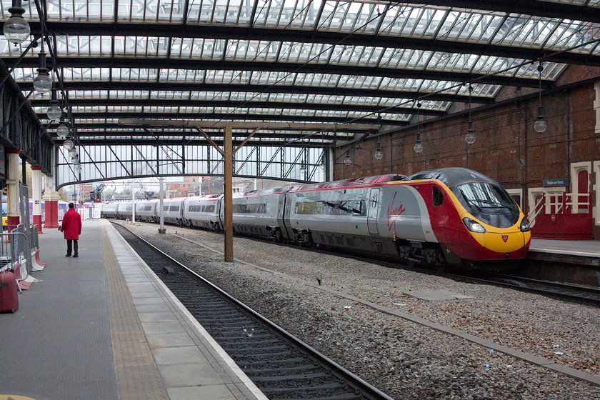 390047, VT 11.15 Manchester Piccadilly-London Euston (1A27), Stoke-on-Trent station 
 390047 arrives at Stoke station working the 11.15 Manchester Piccadilly to Euston. The remaining centre track was removed in 2009 when the platforms were extended. It does mean that the station looks a little less important than it should be give the size of the structure. 
 Keywords: 390047 11.15 Manchester Piccadilly-London Euston 1A27 Stoke-on-Trent station