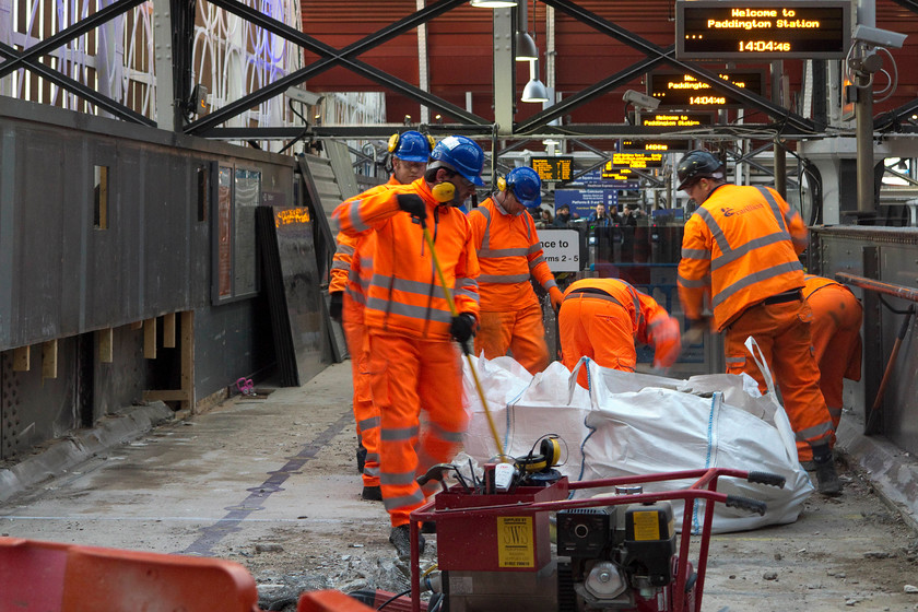 Electrification work, London Paddington station 
 Work being undertaken on the passenger footbridge to prepare it for raising. This was being done so that the electrification wires could be hung at the appropriate height underneath. 
 Keywords: Electrification work London Paddington station