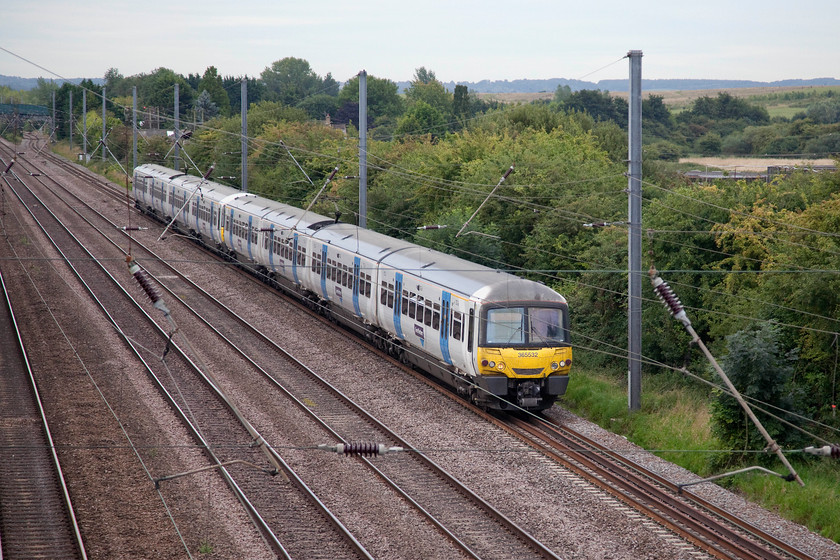 365532 & 365518, GN 08.34 London Kings Cross-Peterborough (2P06, 1E), Arlesey TL189364 
 An eight-car combination of 365532 and 365518 pass Arlesey working the 08.34 King's Cross to Peterborough. The picture is taken from the 'new' footbridge that affords good views of the line and the environment. In the background can be seen the remains of the clay pits that provided the gault clay used to make Arlesey's famous white bricks. Brickwork production finally came to an end in 1992. 
 Keywords: 365532 365518 2P06 Arlesey TL189364