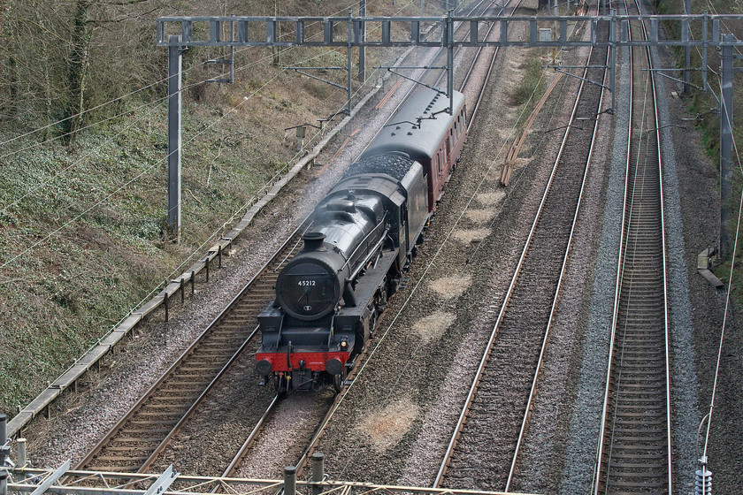 45212, 10.37 Southall West Coast Railways-Carnforth (5Z60, 64E), Hyde Road bridge 
 I had been looking forward to the relatively rare event of a steam-hauled charter on the southern section of the WCML for some months since I first saw it advertised at the end of last year. The Railway Touring Company was running 'The Cheshireman' from Euston to Chester that was to have been hauled by Stanier Black Five 45102 but, due to the banning of mass-gatherings and non-essential travel as a result of the COVID-19 pandemic, it was cancelled. Consequently, the locomotive is seen passing Roade as the 5Z60 10.37 Southall to Carnforth, returning to its north-west home awaiting an unknown future as we all are! 
 Keywords: 45212 10.37 Southall West Coast Railways-Carnforth (5Z60, 64E), Hyde Road bridge LMS Stanier Class 5 4-6-0