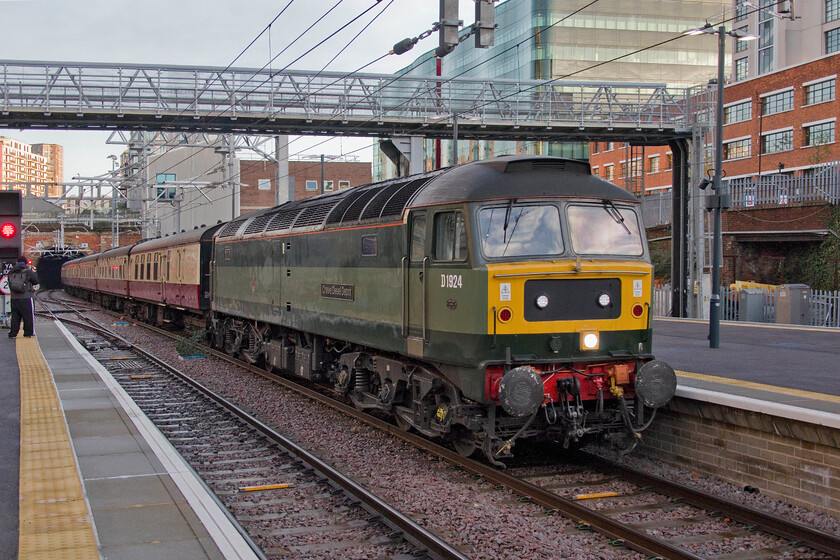 D1924, 02.18 Crewe HS-London King's Cross ECS (5Z45, 15E), London King's Cross station 
 D1924 'Crewe Diesel Depot' eases the empty coaching stock for The Edinburgh Christmas Market charter into King's Cross station. Now owned and operated by LNWR Heritage (Crewe) it is used throughout the country on charter work such as this being now approaching sixty years old. In that time it has carried various numbers, 47247, 47655 and 47810 as well as a variety of names. 
 Keywords: D1924 02.18 Crewe HS-London King's Cross ECS 5Z45 London King's Cross station LSL Crewe Diesel Depot LNWR Heritage