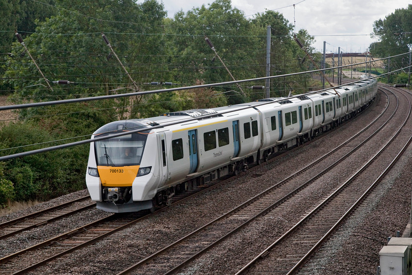 700133, TL 11.26 Brighton-Bedford (9T24, 2L), Sundon TL035269 
 Thameslink's 700133 heads north past Sundon working the 11.26 Brighton to Bedford. Even though this appears to be a quiet rural scene, looks can be deceiving. To my immediate right is the M1 motorway . The constant noise from its procession of vehicles was incessant and spoilt the hour or so I spent n this area. 
 Keywords: 700133 9T24 Sundon South Junction TL035269