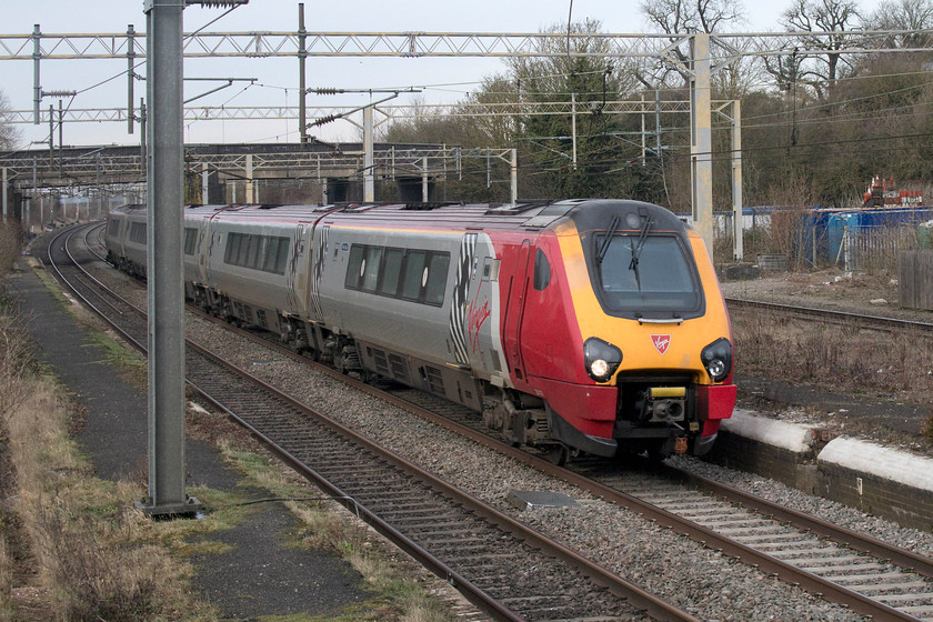 221112, VT 11.50 Birmingham New Street-London Euston (1B40, 6L), site of Castlethorpe station 
 221112 'Ferdinand Magellan' heads south past Castlethorpe forming the VT's 11.50 Birmingham New Street to Euston. From this image, it does not like that it would take much effort to re-open the station at Castlethorpe; however, platforms are only just a tiny part of the process! 
 Keywords: 221112 11.50 Birmingham New Street-London Euston 1B40 site of Castlethorpe station