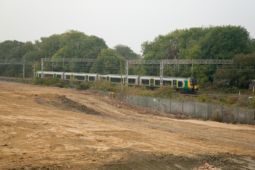 Class 350, 06.01 Crewe-London Euston (1U16), site of Roade station 
 With the bulldozers having done their work on the former Pianofort site, the land is ready for the builders to move in and start building yet another huge housing estate of soulless homes! An unidentified class 350 heads south working the 06.01 Crewe to Euston, just out of shot to the right of this image is the site for the former Roade station. 
 Keywords: Class 350 06.01 Crewe-London Euston 1U16 site of Roade station