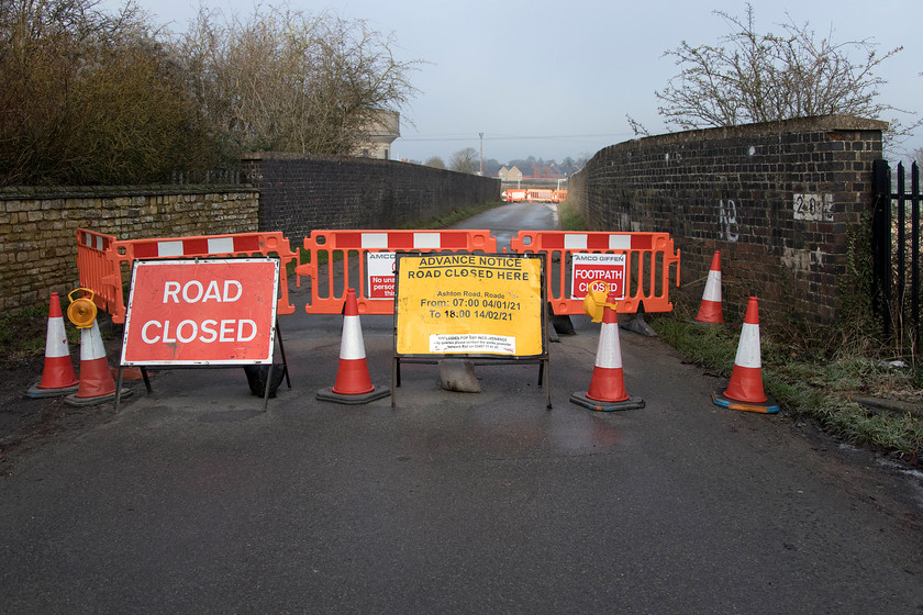 Road closure, Ashton Road bridge (Bridge 204) 
 Network Rail (via its contractor Amco Giffen) is making things thoroughly awkward for the residents of the villages of Roade and Ashton in Northamptonshire by closing the minor road that links the two villages and necessitating a diversion. The closure is for six weeks and, as yet, nearly a week in nothing on the bridge appears to actually be taking place. This bridge is number 204 from Euston and was constructed, largely from concrete, in the middle of the 1960s when the line was electrified. It replaced a traditional brick arched structure that did not provide enough clearance. 
 Keywords: Road closure Ashton Road bridge Bridge 204