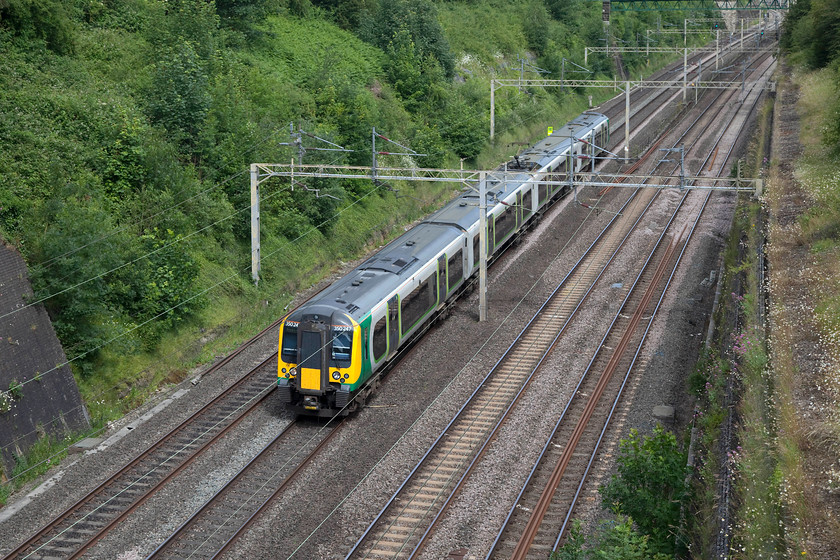 350247, LN 10.00 Coventry-London Euston (1W08, 1L), diverted on the up fast, Roade Cutting 
 It's not out of the ordinary to see a class 350 passing through Roade Cutting but forming this particular service is unusual. Due to the emergency closure of the line between Northampton and Rugby train planners had to make some quick decisions. One was to create this 10.00 Coventry to London Euston (via the Weedon loop) working. It obviously missed out its Long Buckby and Northampton stops and arrived in London only one minute late. It is unfortunate that this incident occurred on this particular day as there were many extra passengers who were travelling to London to attend the anti-BREXIT demonstration, as my mum and her partner did. 
 Keywords: 350247 1W08 Roade Cutting