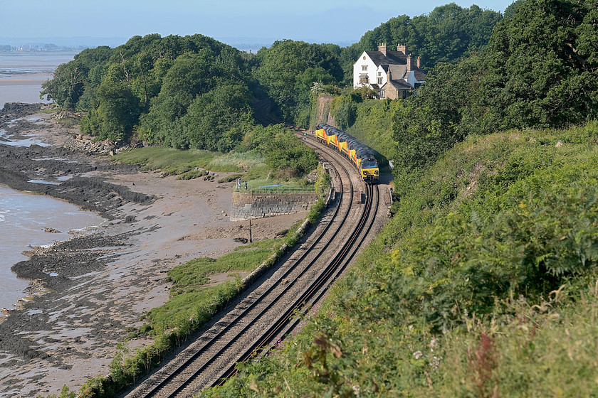 70805, 70814, 70813, 70812 & 70803, 07.30 Cardiff Canton-Bescot (0Z98), Purton SO672049 
 A quadripartite of class 70s make their way along the Severn Estuary passing the village of Purton in Gloucestershire. In lead order they are, 70805, 70814, 70818, 70812 and 70803. All four were making their way as the 07.30 Cardiff Canton to Bescot 0Z98 working. This lofty and commanding position is only possible now due to a massive clearance of the bank followed by a stabilisation programme involving huge cables and pilings. 
 Keywords: 70805 70814 70813 70812 70803 07.30 Cardiff Canton-Bescot 0Z98 Purton SO672049