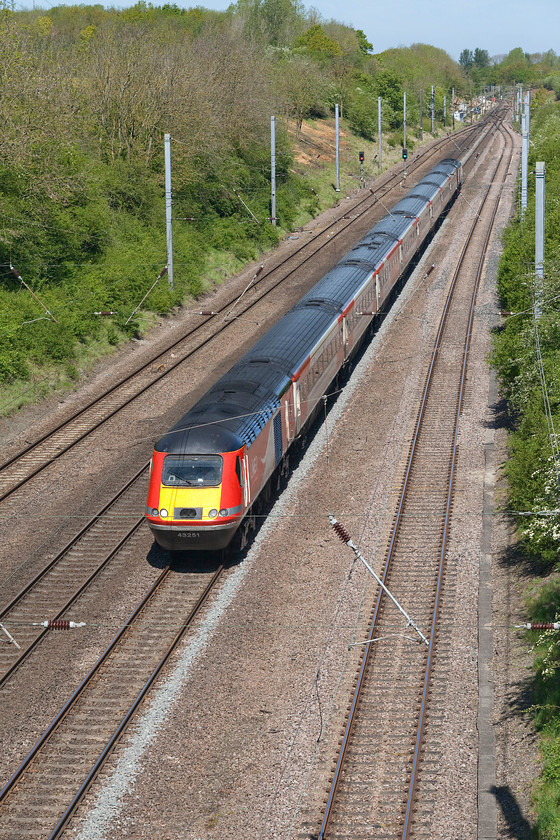 43251, GR 07.30 Edinburgh-London King`s Cross (1E05, 11L), High bridge, Westby SK962271 
 The 07.30 Edinburgh to King's Cross HST service thunders down Stoke bank with 43251 leading the train. It is seen from the top of High bridge that lies at the end of a long and very rutted track west of the small Lincolnshire village of Westby. Unfortunately, the bridge parapets have had huge 'anti-suicide' tops added thus a ladder is needed to gain a vantage point such as this one. Whenever I go out, I take one of two ladders with me that usually are used sometime during the trip! 
 Keywords: 4325 07.30 Edinburgh-London King`s Cross 1E05 High bridge, Westby SK962271