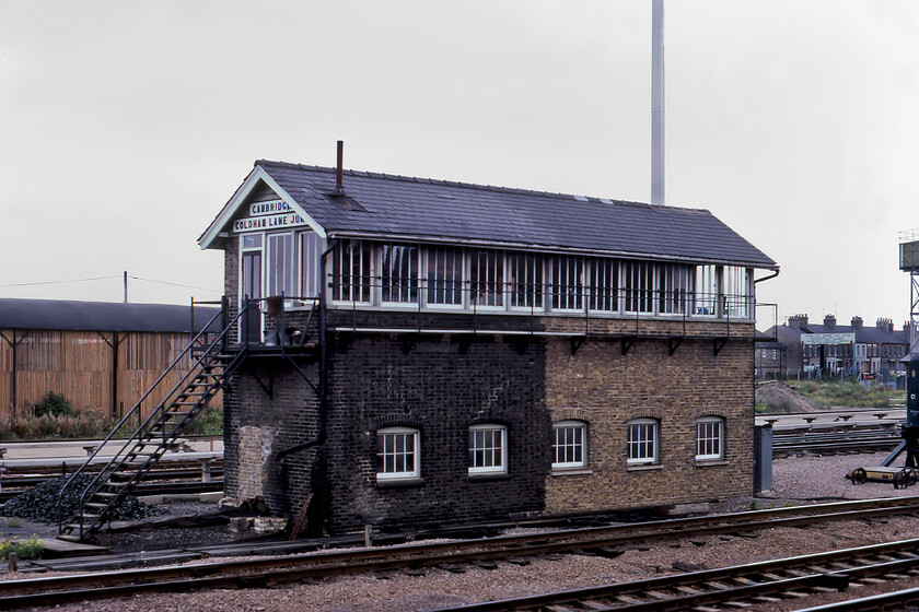 Cambridge Coldham Lane Junction signal box (LNER, 1896) 
 The impressive and substantial LNER Cambridge Coldham Lane Junction signal box dating from 1896 is seen to the north of Cambridge station and the associated sidings. As can be seen, it was extended when a new one-hundred-and-one lever frame was installed in 1959. The box still wears its large relief wooden nameboard (on this, the northern end of the box at least). Notice the huge mound of coal at the bottom of steps no doubt to service the needs of the signalmen over the coming months. The box was to close less than a year after this photograph was taken. 
 Keywords: Cambridge Coldham Lane Junction signal box LNER London and North Eastern Railway