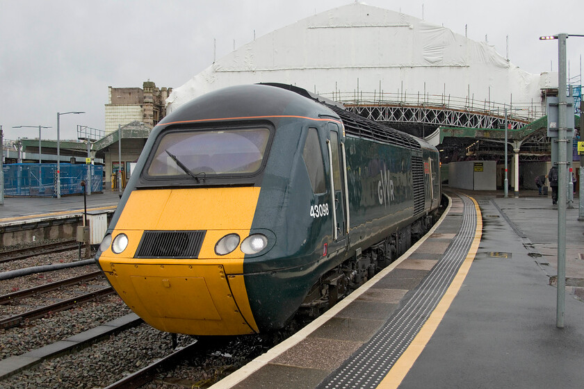 43098, GW 05.40 Penzance-Cardiff Central (2U10, 1E), Bristol Temple Meads station 
 Another HST working that we would have taken but it would have taken us straight out of our Freedom Travelpass validity area waits at Bristol Temple Meads. 43 098 'Walton Castle' will lead the short set working the 05.40 from Penzance to Cardiff. Notice that the grand trainshed in the background is covered with plastic sheeting as it undergoes a huge renovation and cleaning that is just a part of the wider regeneration of the station and its surrounding environs. 
 Keywords: 43098 05.40 Penzance-Cardiff Central (2U10, 1E), Bristol Temple Meads station Walton Castle