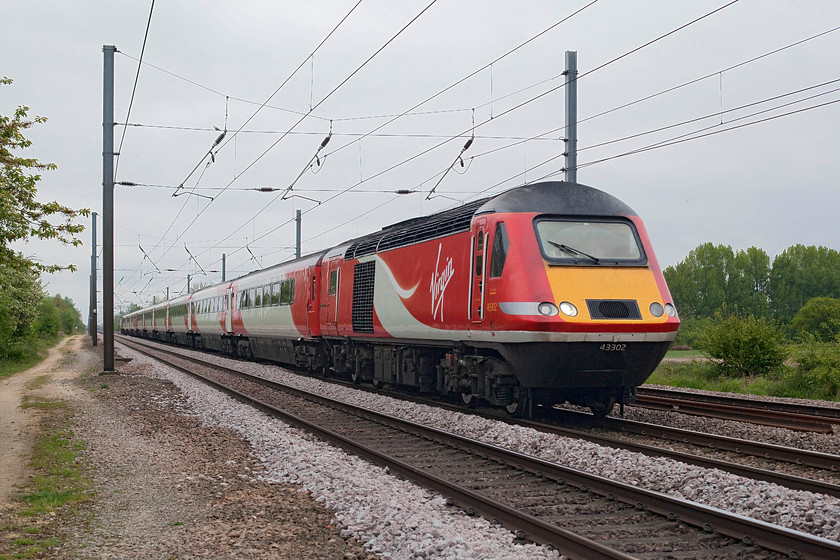 43302, GR 12.03 London Kings Cross-Leeds (1D13, 1L), White House Crossing TL227777 
 This power car, 43302, has beaten a track up and down the ECML for much of its life apart from a spell when it was with Virgin West Coast and Virgin Cross Country. As 43102 it was part of set 254024 that was introduced slightly later than the first batch. It is seen here passing White House Crossing with the 12.03 King's Cross to Leeds. 
 Keywords: 43302 1D13 White House Crossing TL227777