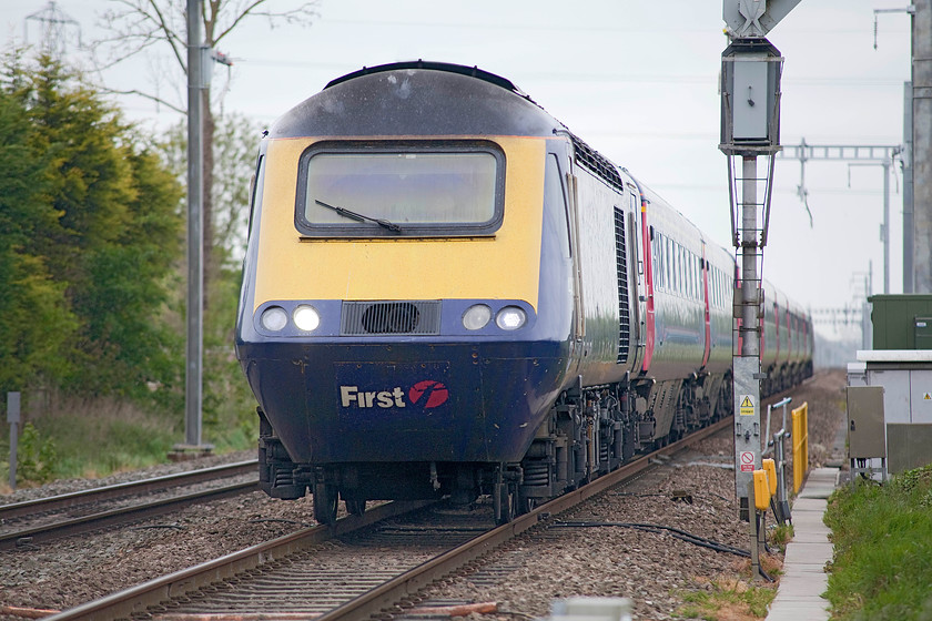 Class 43, GW 13.00 Bristol Temple Meads-London Paddington (1A18, RT), Steventon Causeway Crossing 
 An unidentified class 43 HST speeds eastwards forming the 13.00 Bristol to Paddington working. The train is about to cross Causeway Level Crossing in the village of Steventon. Recently, the crossing keeper and hut was removed as the pair of crossings in the village became fully automated. This created a a huge fuss in the village and rightly so as the barriers now stay down for an awful long time compared with when they were operated by a keeper. 
 Keywords: Class 43 1A18 Steventon Causeway Crossing