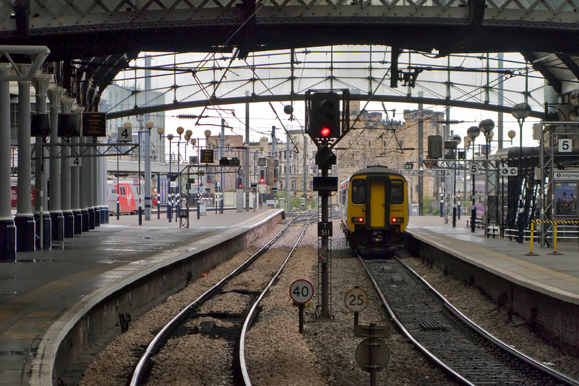 91109, VTEC 13.25 York-Edinburgh Waverley (1F15) & 156443, NT 13.42 Hexham-Nunthorpe (2N30), Newcastle station 
 Looking through the trainshed of Newcastle station towards The Keep 156443 is waiting to leave with the Northern Trains 13.42 Hexham to Nunthorpe service. Over to the left, 91109 'Sir Bobby Robson' is seen wearing its Virgin East Coast flash down its bodyside leading the 1F15 13.25 York to Edinburgh Waverley. Like all electric services at Newcastle over this weekend, their journeys were either terminating or departing from York due to engineering works. 
 Keywords: 91109 13.25 York-Edinburgh Waverley 1F15 156443 13.42 Hexham-Nunthorpe 2N30 Newcastle station Northern Trains sprinter Virgin East Coast Sir Bobby Robson