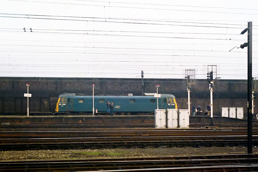 85039, up parcels working, Crewe station 
 Another broadside shot at Crewe station. This time, it shows 85039 on an up parcels working. 85039 lasted until March 1987. It was broken up at MC Metals in Glasgow in 1989. 
 Keywords: 85039 Crewe