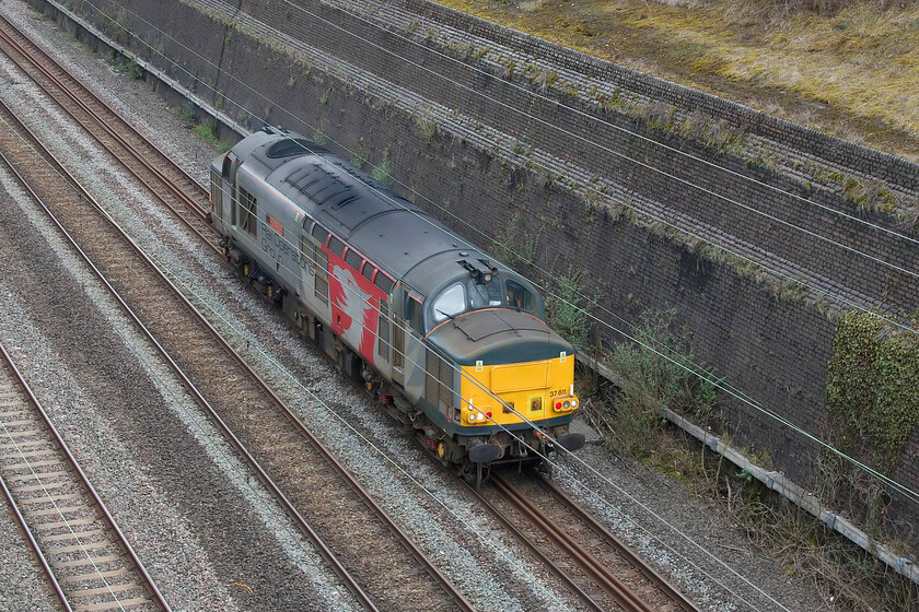 37611, 13.30 Derby RTC-Wembley Yard (0H72, 44E), Roade cutting 
 The first train of the interesting Sunday afternoon trilogy passes southbound through Roade cutting. Europheonixs 37611 Pegasus as the 0H72 13.30 Derby RTC to Wembley Yard travelled south along the MML from Derby to Wigston North Junction where it headed west for a reversal at Nuneaton before continuing south via the WCML route through Rugby and Northampton. This working would more commonly take the MML further south to Bedford where it would take the Marston Vale line to Bletchley. I am not sure why it took the more circuitous route today but I am not complaining! 
 Keywords: 37611 13.30 Derby RTC-Wembley Yard 0H72 Roade cutting Pegasus tractor Europhenix