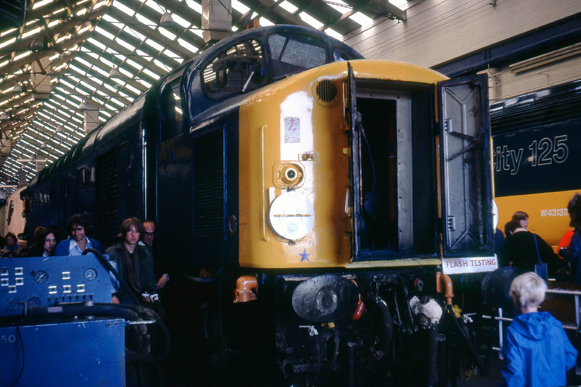 40008, undergoing repair & 43133, new build, Crewe Works 
 40008 caught fire at Aberdeen on 01.08.79 arriving at Crewe six days later. It has just about finished receiving classified repairs and would be released into traffic a week after this picture was taken. Next to it, HST power car 43133 is looking as though it is nearly ready for release into traffic during October. 43133 went to the Western Region to bolster their fleet, ostensively as services to rolled out on the west of England route into Devon and Cornwall. At the time of writing, this power car is one that has received an overhaul and is seeing further use on the Scottish Region. Behind the class 40 is another HST power car in pink primer. I believe that this is 43137 but its release date as June 1980 suggests that it may not be....advice anybody? 
 Keywords: 40008 repair 43133 Crewe Works