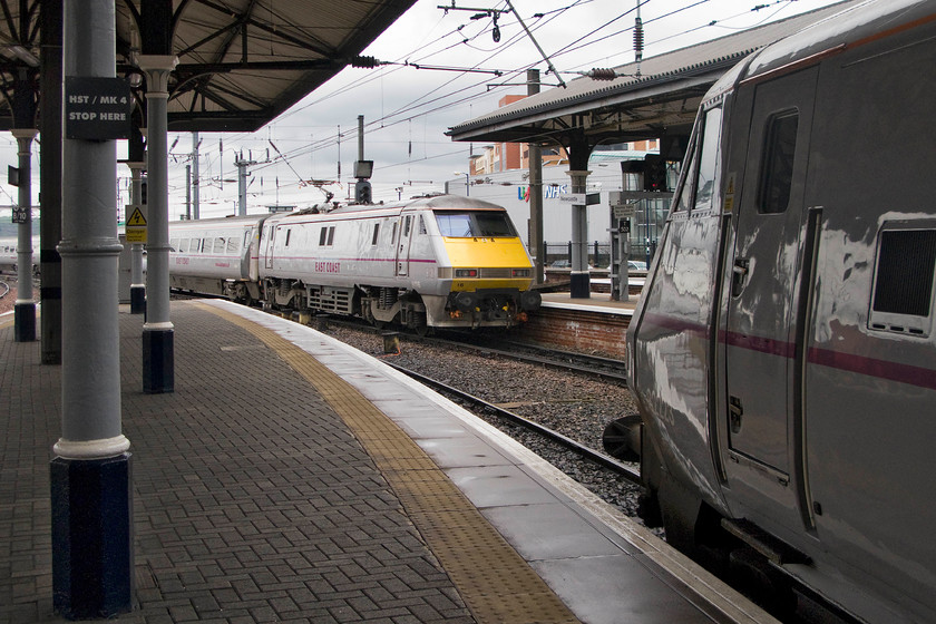 82223, VTEC 13.00 Edinburgh Waverley-York (1E16) & 91116, VTEC 13.25 York-Edinburgh (1F15), Newcastle station 
 To the right, dvt 82223 waits to leave Newcastle leading the 13.00 Edinburgh Waverley to York. 91116 is seen arriving on the adjacent platform with the 13.25 York to Edinburgh running as 1F15. RTT was not having a 'funny' and I was reading it properly, all electric services north of York were starting at and terminating from the station due to weekend engineering works between Colton Junction and Doncaster. 
 Keywords: 82223 13.00 Edinburgh Waverley-York 1E16 91116 13.25 York-Edinburgh 1F15 Newcastle station